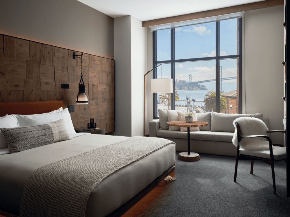 Hotel room with a king bed and a window sofa